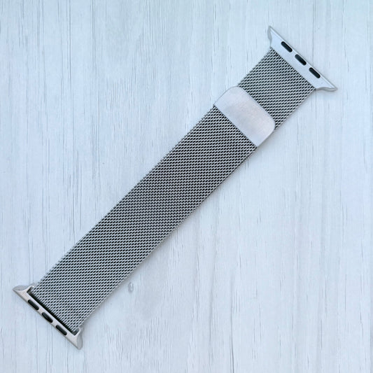 Milanese Loop Strap For Apple watch on a White wooden surface