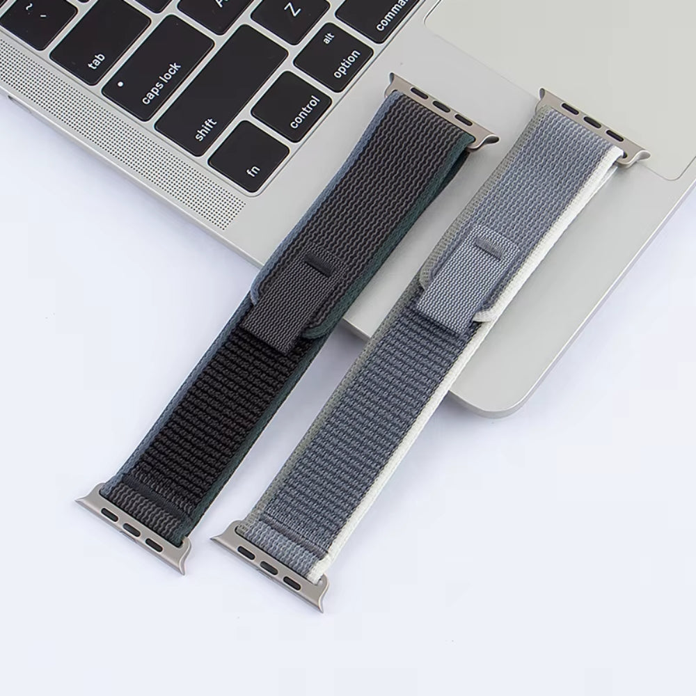 Multiple Trail Loop Apple Watch bands in a variety of colors including Yellow Beige, Blue Gray, Black Gray, Orange Beige, Gray White, Blue Black, Army Green, Orange, and Sea Salt—shown together to highlight the breathable nylon design and sporty, stretchable fit for Apple Watch Ultra and Series 9/8/7.