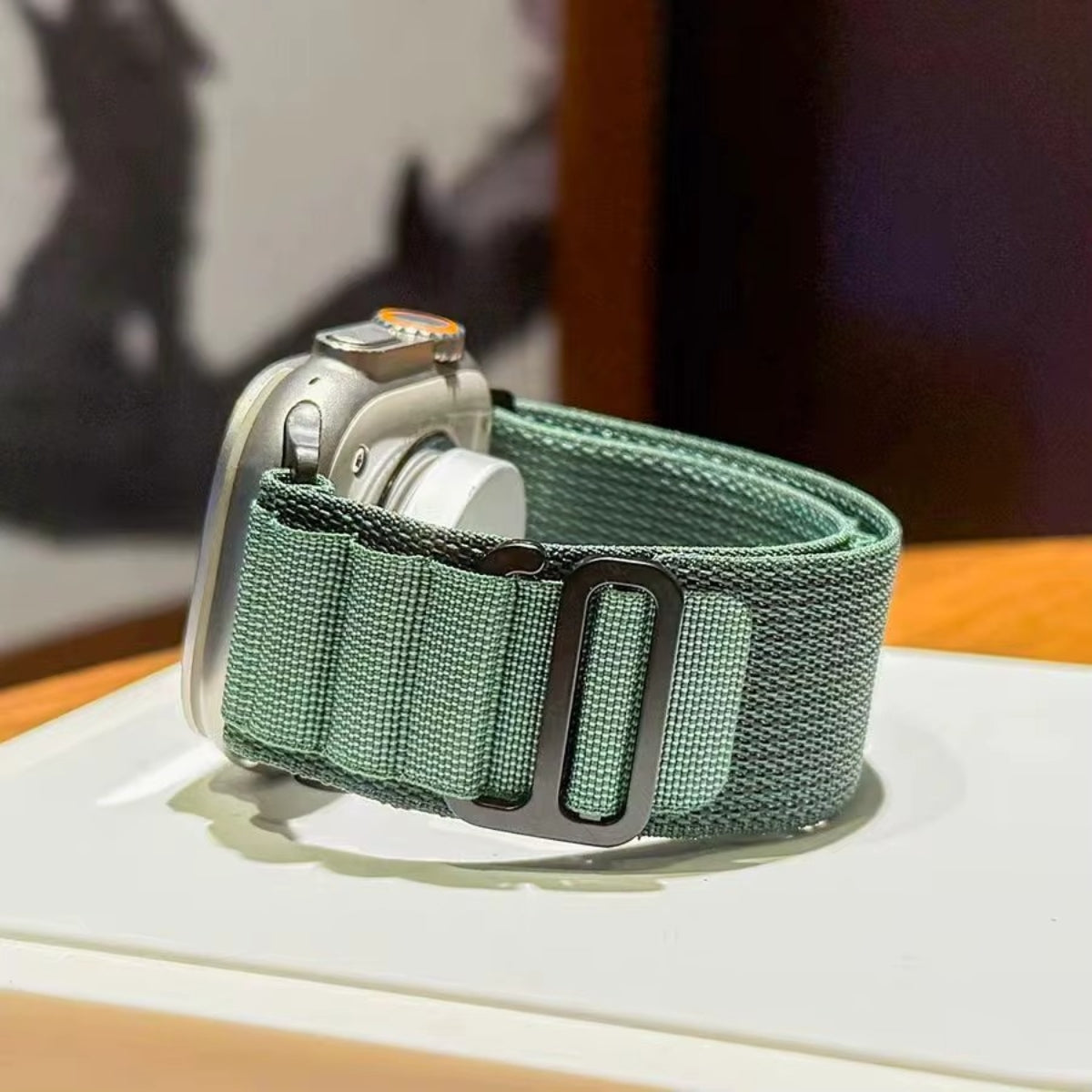 Close-up of Dark Green Alpine Loop fabric and black titanium G-hook