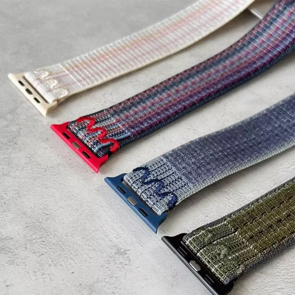 Close-up of durable nylon band connector for Apple Watch, featuring secure and precise fit with rugged finish.