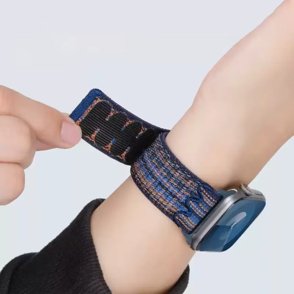 Close-up of secure nylon strap fastener – strong hook-and-loop design with stainless steel connector for Apple Watch.