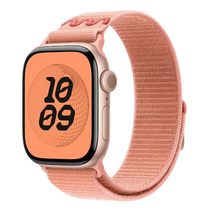 Apple Watch series 10 with a Alpenglow Pink Nike sport loop band on a white background