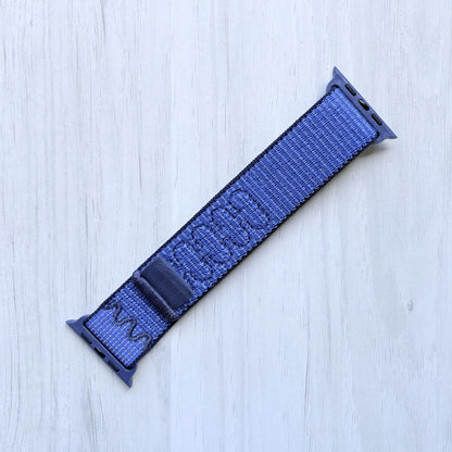 Blue Ribbon Nike sport loop band for apple watch on a white background, front side.