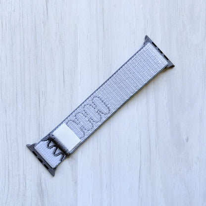Veiled Grey Woven Nike sport loop band on a white background, front side.