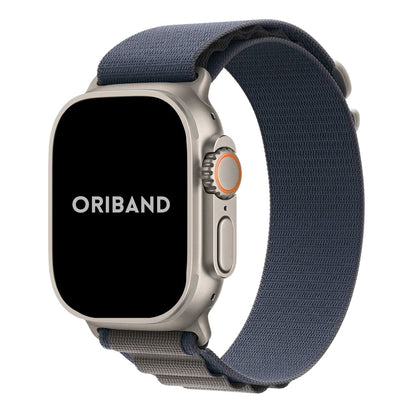Apple Watch Ultra with a sleek titanium case paired with a Blue Alpine Loop band front view.