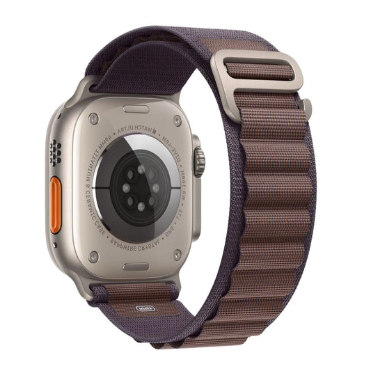 Apple Watch Ultra with a Indigo strap on a white background