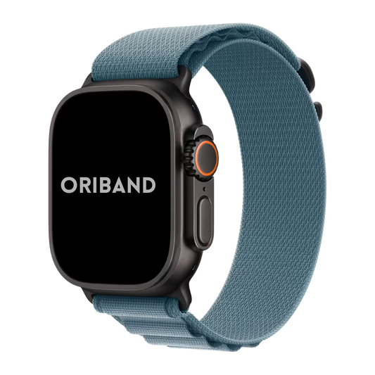 Black Apple Watch Ultra 3 with a light blue alpine loop band on a white background, featuring the brand 'Oriband'.