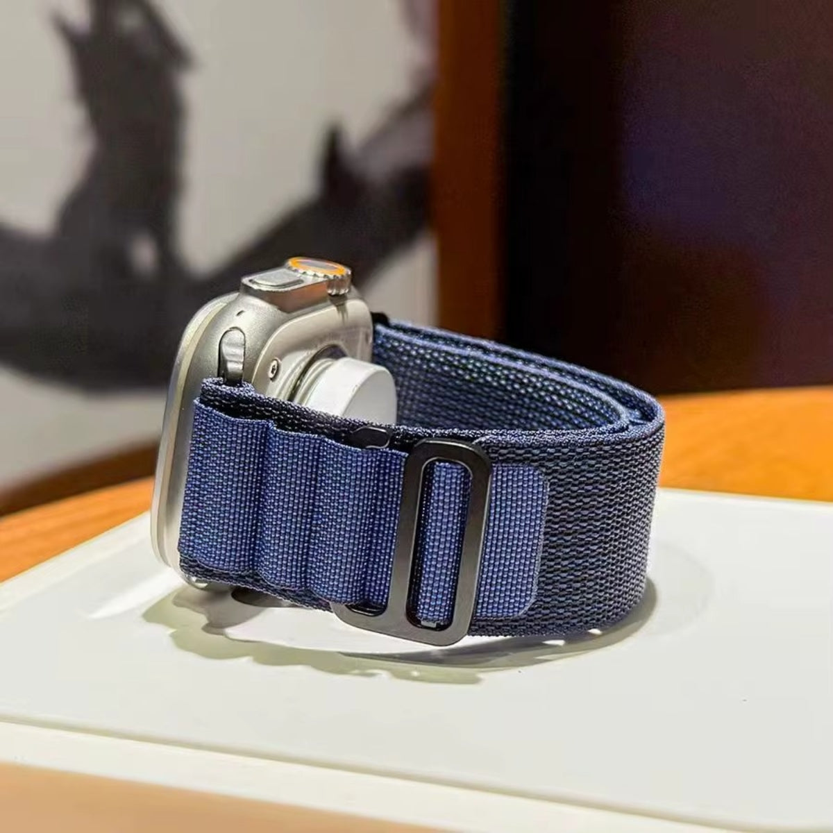 Close-up of Navy Alpine Loop fabric and black titanium G-hook