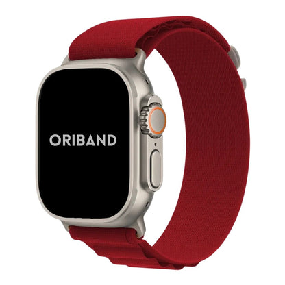 Titanium Apple watch ultra with a red Alpine Loop band on a white background, featuring the brand 'Oriband'.