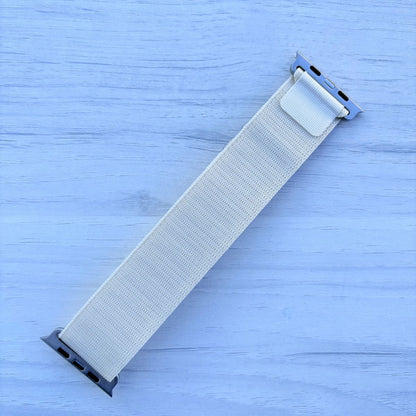 Starlight Alpine Loop nylon band with titanium finish back view in a light white wooden background