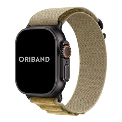 Apple Watch Ultra in black finish with nylon alpine loop band in Tan on a white background, featuring the brand 'Oriband'.