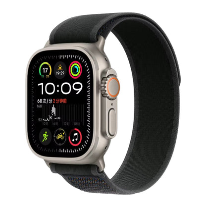 Titanium Apple Watch Ultra with a Black Trail loop band on a white background