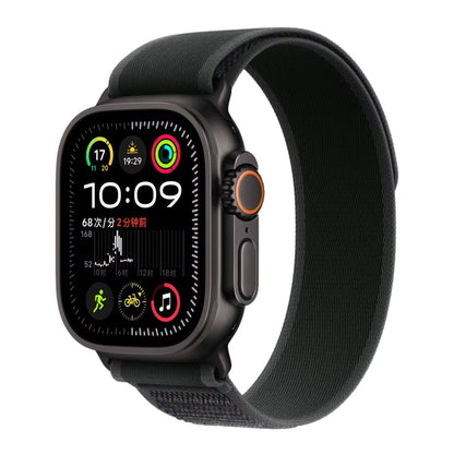 Black Apple Watch Ultra with a Black Trail loop band on a white background