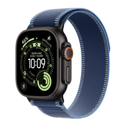 Black Apple Watch Ultra with a Bright blue Trail loop band on a white background