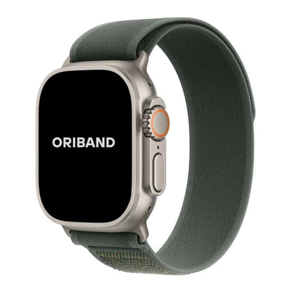 Green Trail Loop Apple Watch band with silver connector – stylish and stretchable band perfect for workouts or casual wear.