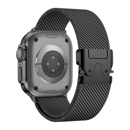 Black Milanese loop stainless steel Apple Watch band attached to an Apple Watch Ultra, featuring a modern design and a secure parachute buckle.