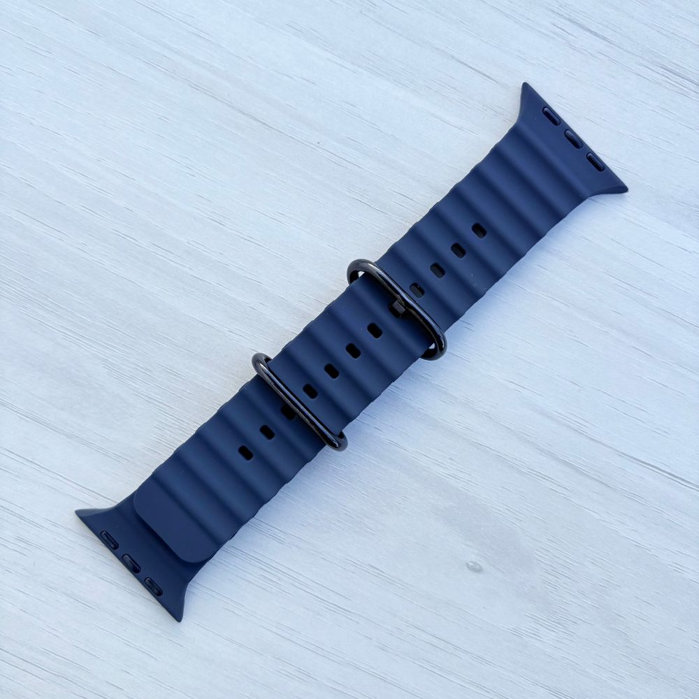 Ocean Band for Apple Watch in Navy with Black Buckle, Front View on Light Wooden Surface
