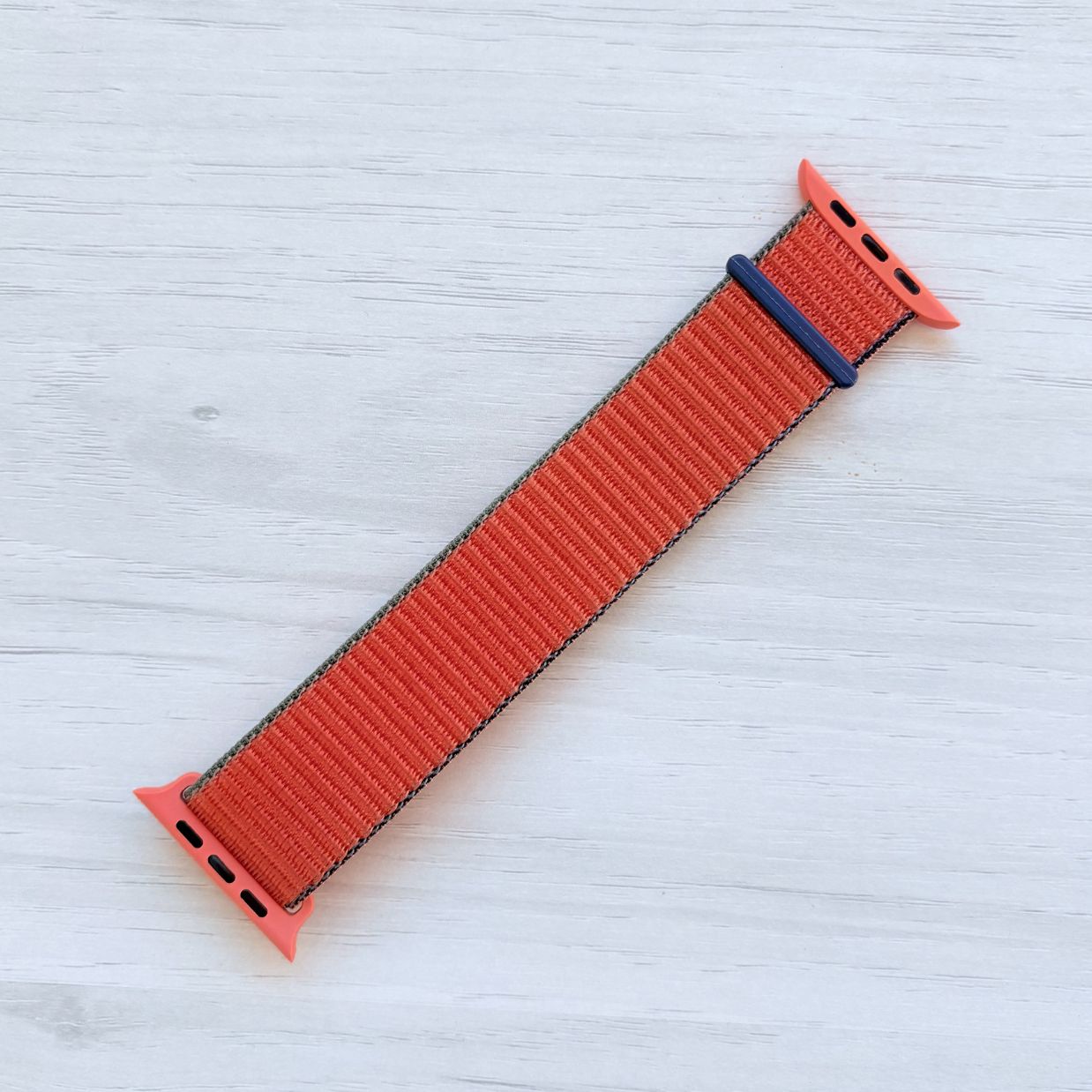 Kumquat Sport Loop Apple Watch Band with woven nylon design, front view.