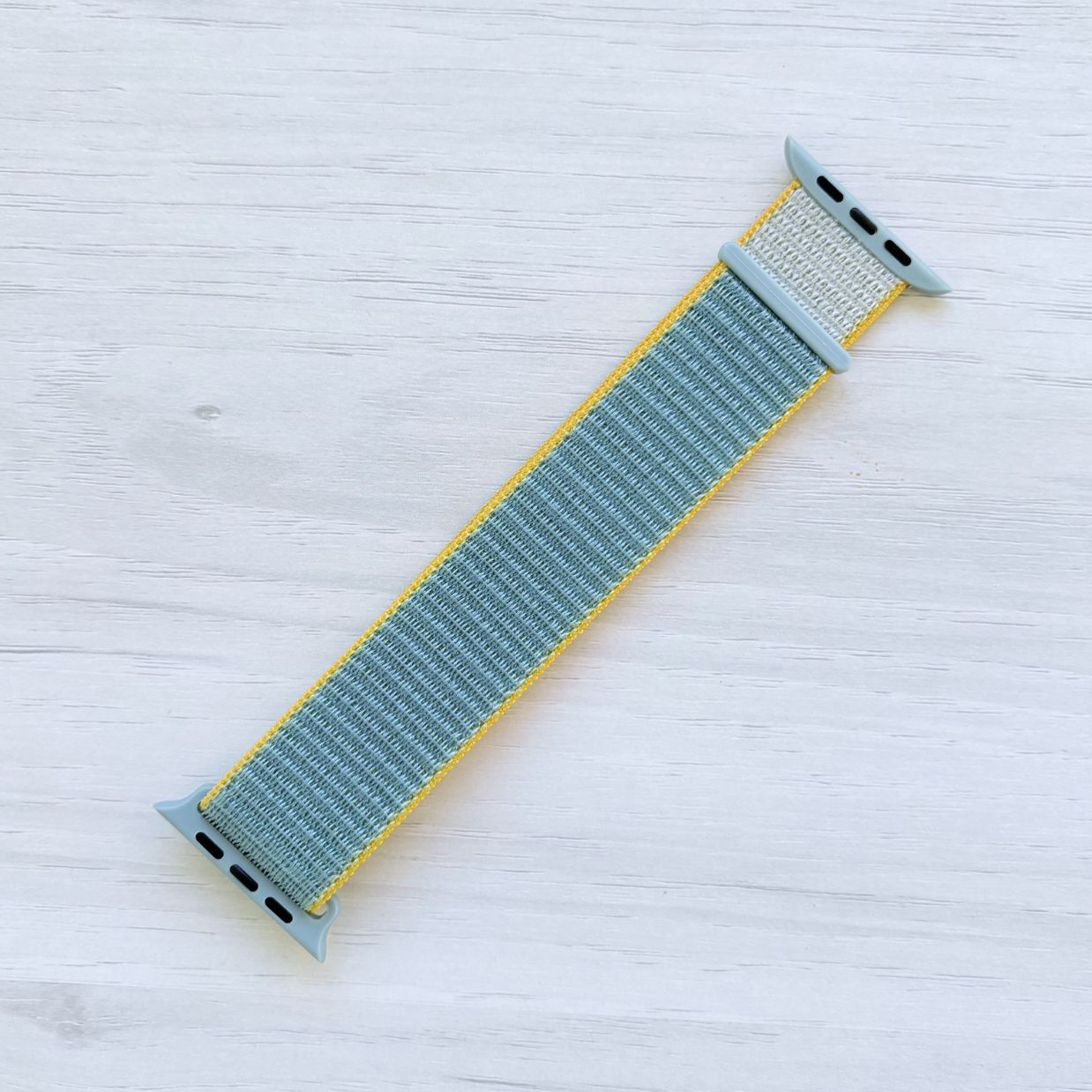 Sunshine Sport Loop Apple Watch Band attached to Apple Watch with Oriband logo, front view.