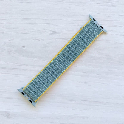 Sunshine Sport Loop Apple Watch Band attached to Apple Watch with Oriband logo, back view.