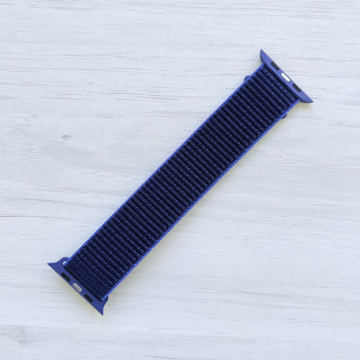Ultramarine Sport Loop Apple Watch Band with woven nylon design, back view.
