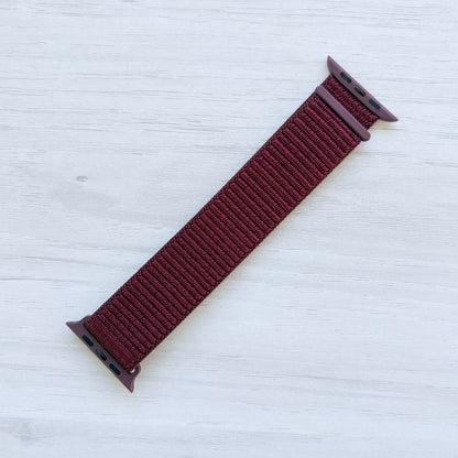 Plum Sport Loop Apple Watch Band with woven nylon design, front view.
