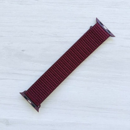 Plum Sport Loop Apple Watch Band with woven nylon design, back view.