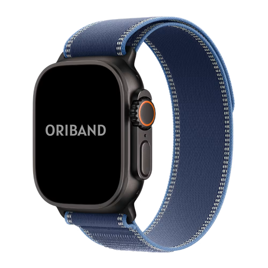 Black Apple watch Ultra 3 with a blue Alpine Loop strap on a white background, featuring the brand 'Oriband'.