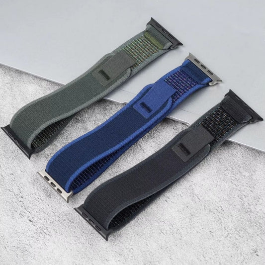 Trail Loop Apple Watch bands in Black, Green, and Blue – rugged nylon straps with black and silver connectors, shown side by side for color comparison and style versatility.
